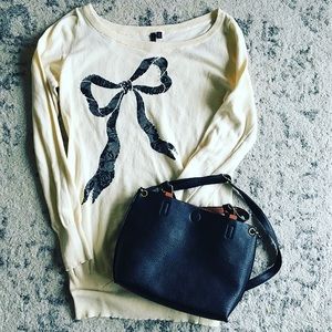 Material Girl off white bow sweater